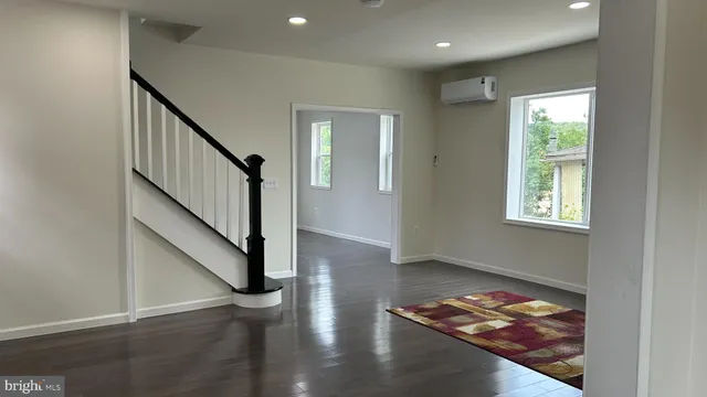 a view of entryway with wooden floor