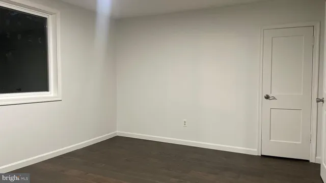 an empty room with a wooden door