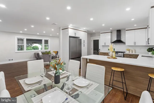 a kitchen with a table and chairs in it