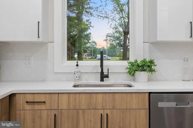 a kitchen with a sink and cabinets