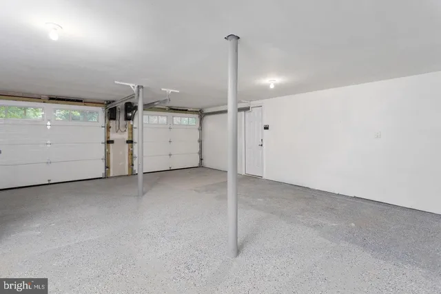 a view of a room with a garage