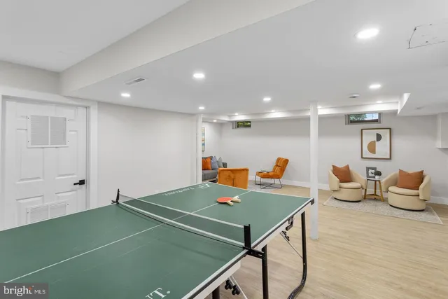 a room with table tennis and wooden floor