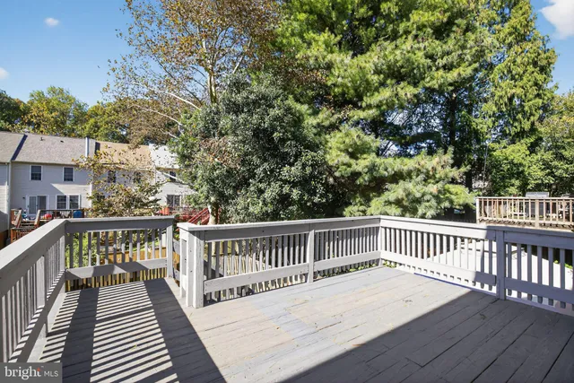 a view of wooden deck and a garden