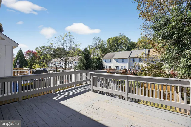 a view of a balcony with wooden floor