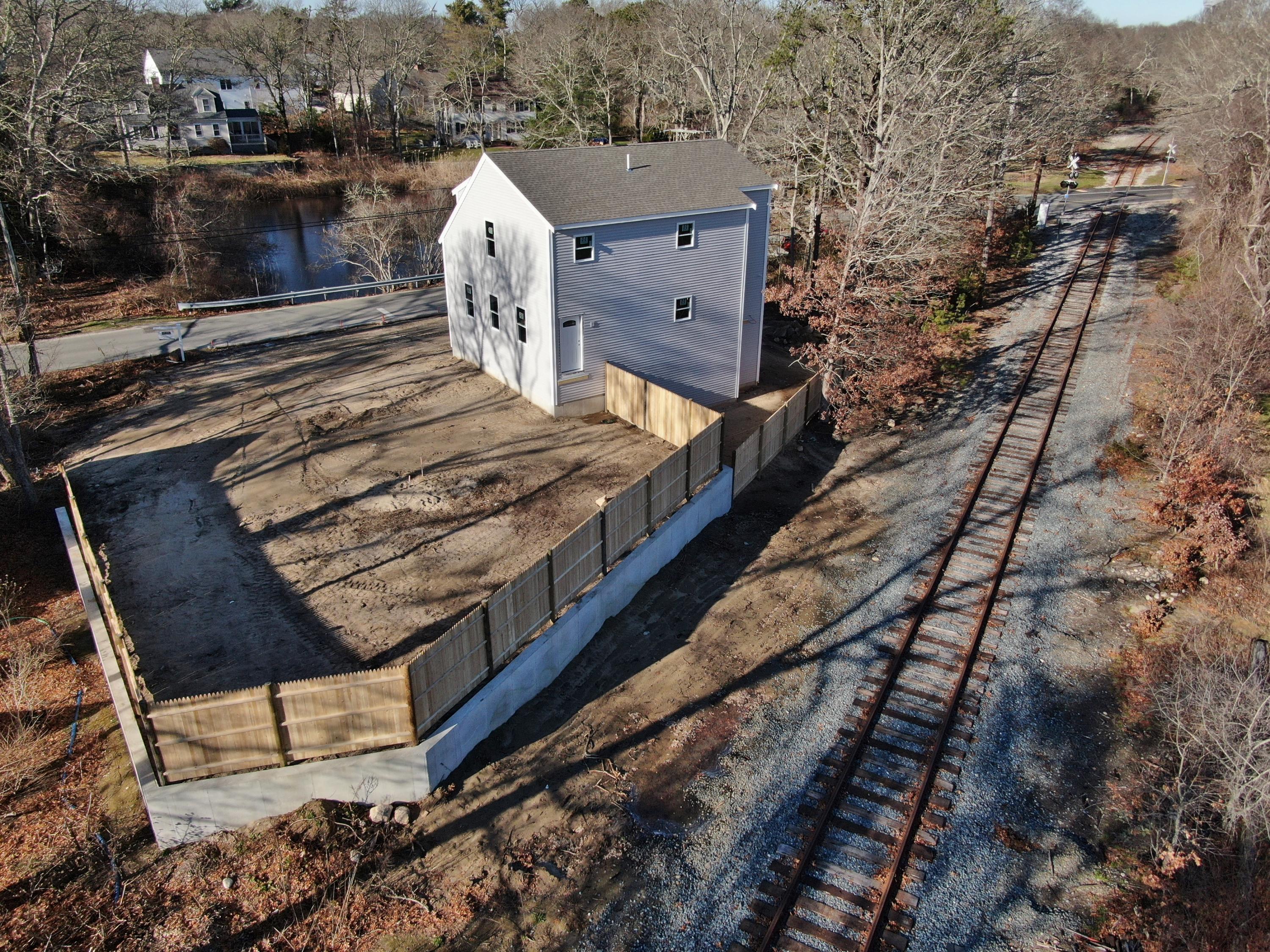 49 Monument Neck Road Buzzards Bay, MA 02532 - Photo 15 of 24 a view of a house with a bed