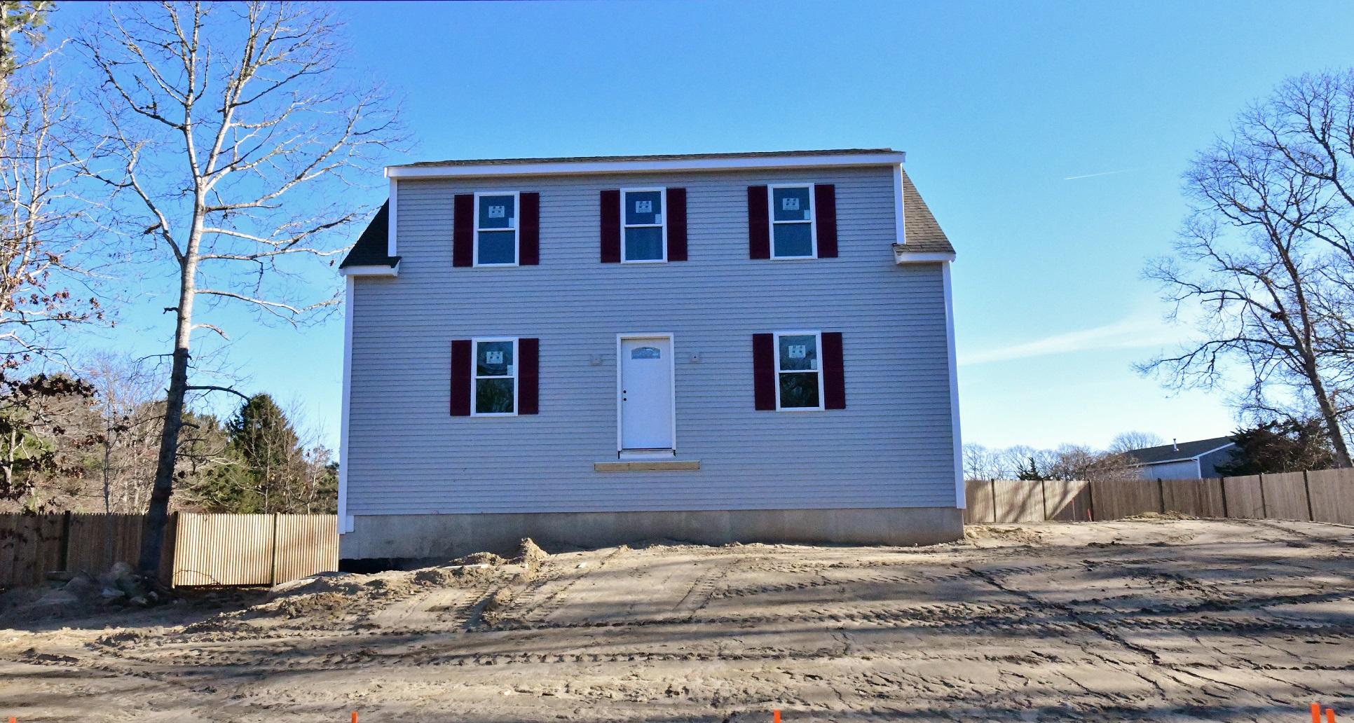 49 Monument Neck Road Buzzards Bay, MA 02532 - Photo 19 of 24 a front view of a house with a yard