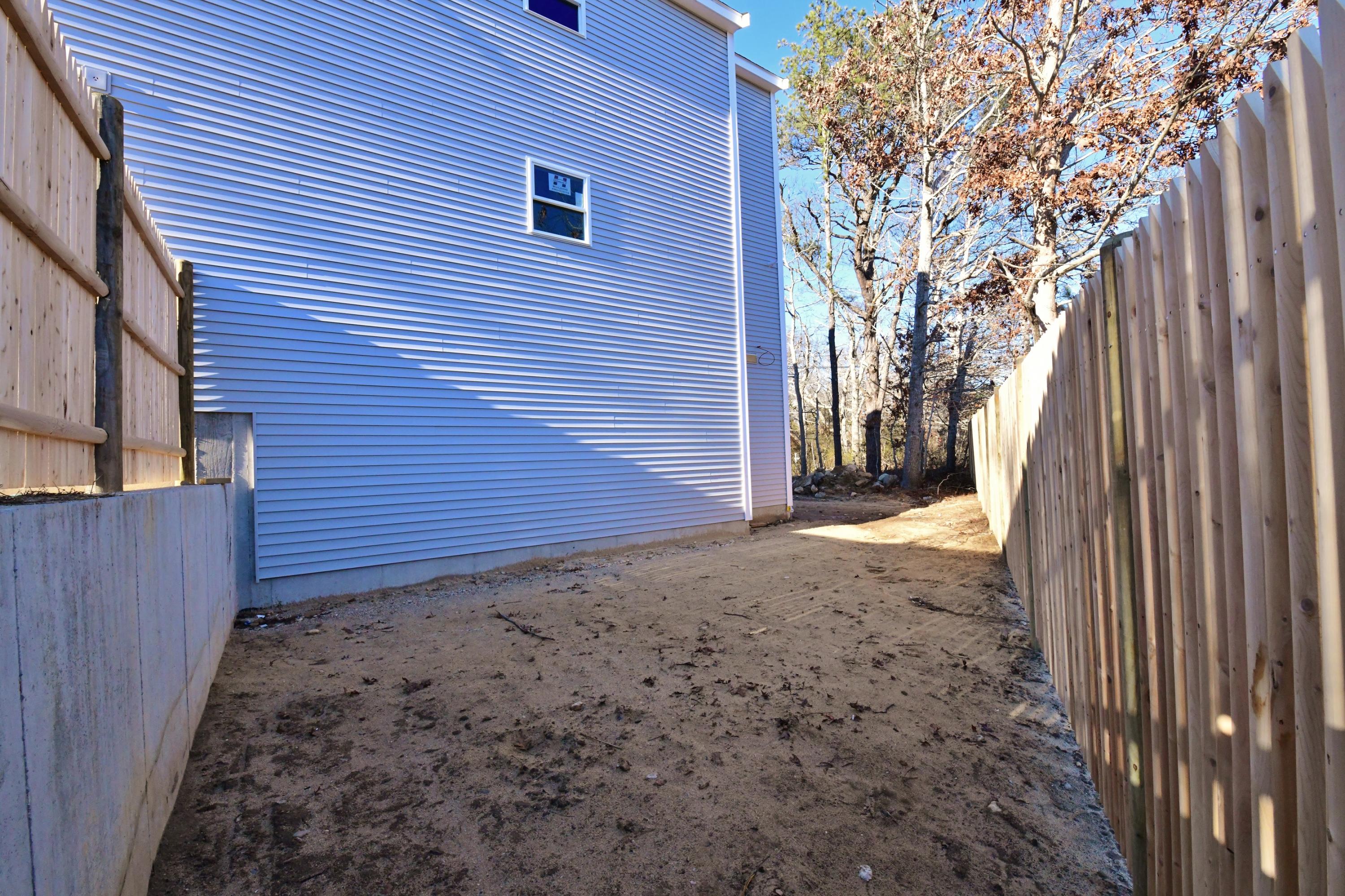 49 Monument Neck Road Buzzards Bay, MA 02532 - Photo 21 of 24 a view of a backyard of the house