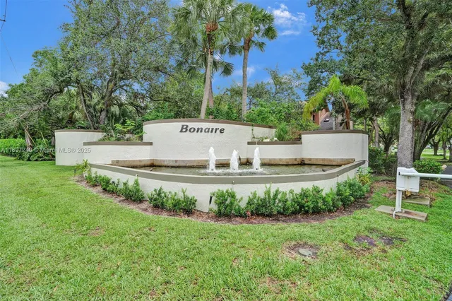 a view of a park with large trees