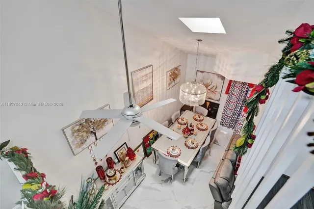 a view of living room with furniture and flower pot