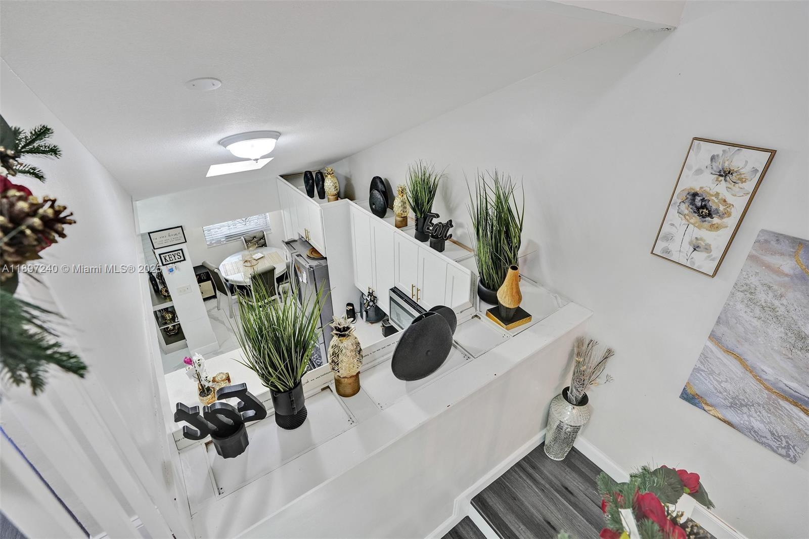 7780 Northwest 79th Avenue, Unit F6 Tamarac, FL 33321 - Photo 14 of 27 a view of living room with furniture and flower pot
