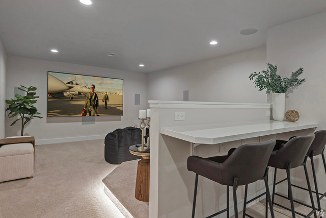 16 Gatehouse Lane Sandy, UT 84092 - Photo 48 of 73 Bar featuring light carpet, recessed lighting, and light countertops