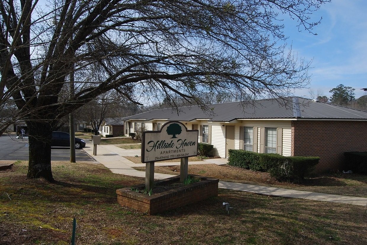 135 Armory Street Other, AL 35072 - Photo 2 of 6 a front view of a house with garden and trees