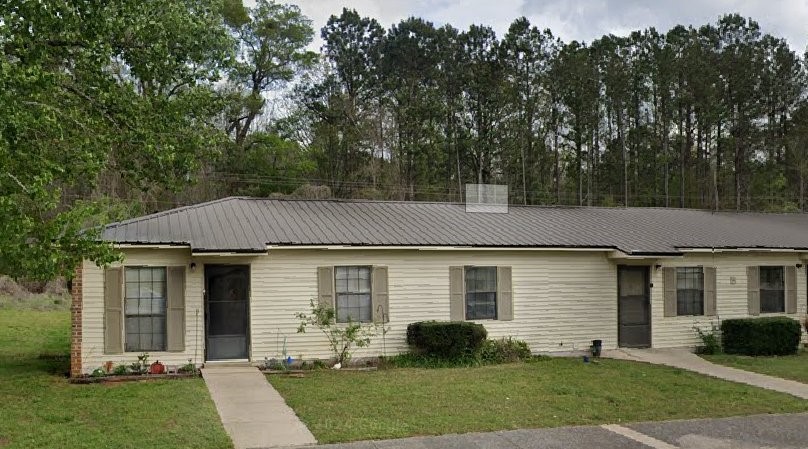 135 Armory Street Other, AL 35072 - Photo 3 of 6 a front view of a house with a yard and outdoor seating