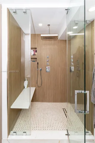a bathroom with a sink and shower