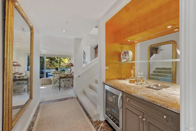 a spacious bathroom with a granite countertop sink and a mirror