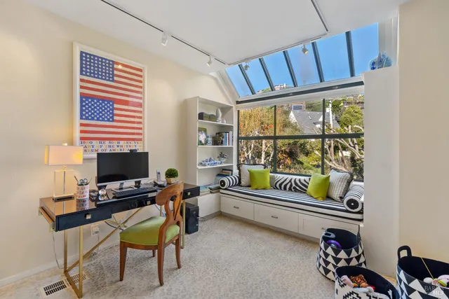 a workspace with furniture and window