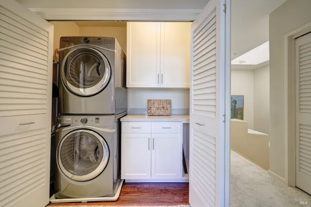 a view of a hallway with washer and dryer