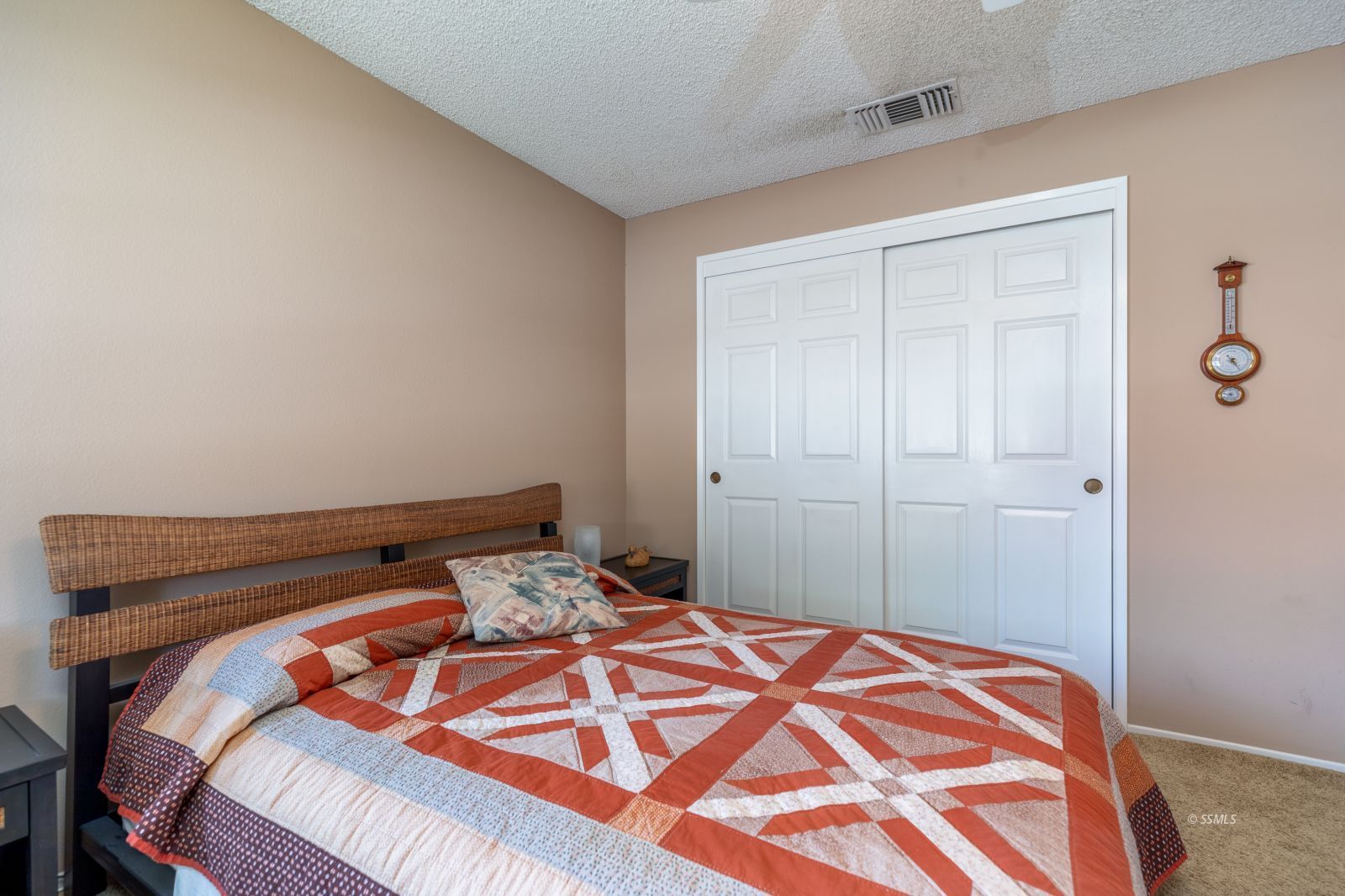 213 Washington Way Ridgecrest, CA 93555 - Photo 20 of 25 a bedroom with a bed and a lamp on the dresser