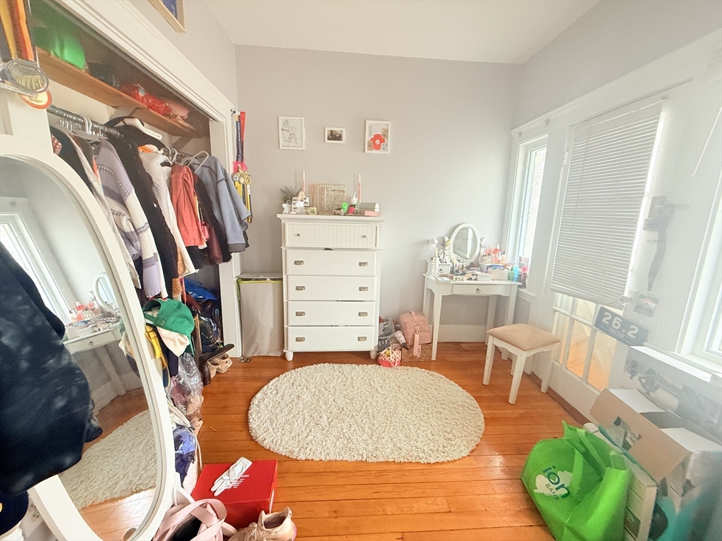 15 Chester Street, Unit 4 Boston, MA 02134 - Photo 14 of 20 a living room with furniture and a wooden floor