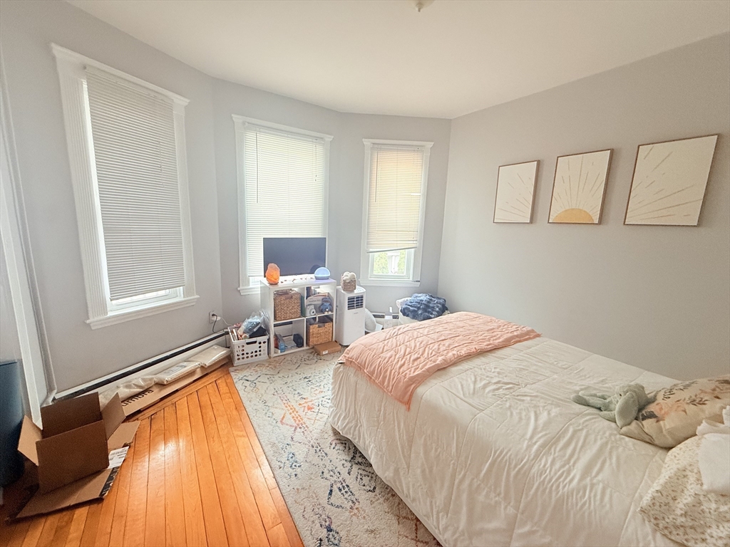 15 Chester Street, Unit 4 Boston, MA 02134 - Photo 15 of 20 a bedroom with a bed and a window