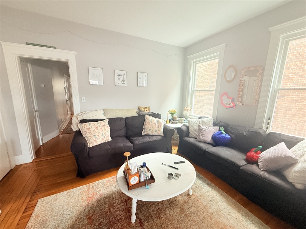 15 Chester Street, Unit 4 Boston, MA 02134 - Photo 16 of 20 a living room with furniture and a large window