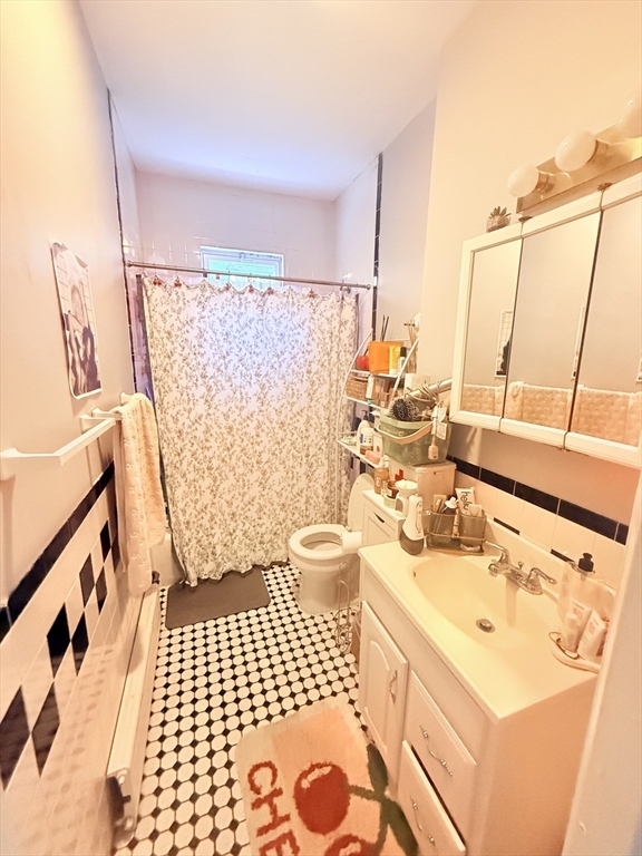 15 Chester Street, Unit 4 Boston, MA 02134 - Photo 20 of 20 a bathroom with a sink toilet and shower