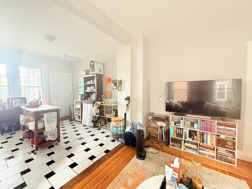 15 Chester Street, Unit 4 Boston, MA 02134 - Photo 5 of 20 a living room with furniture and a flat screen tv
