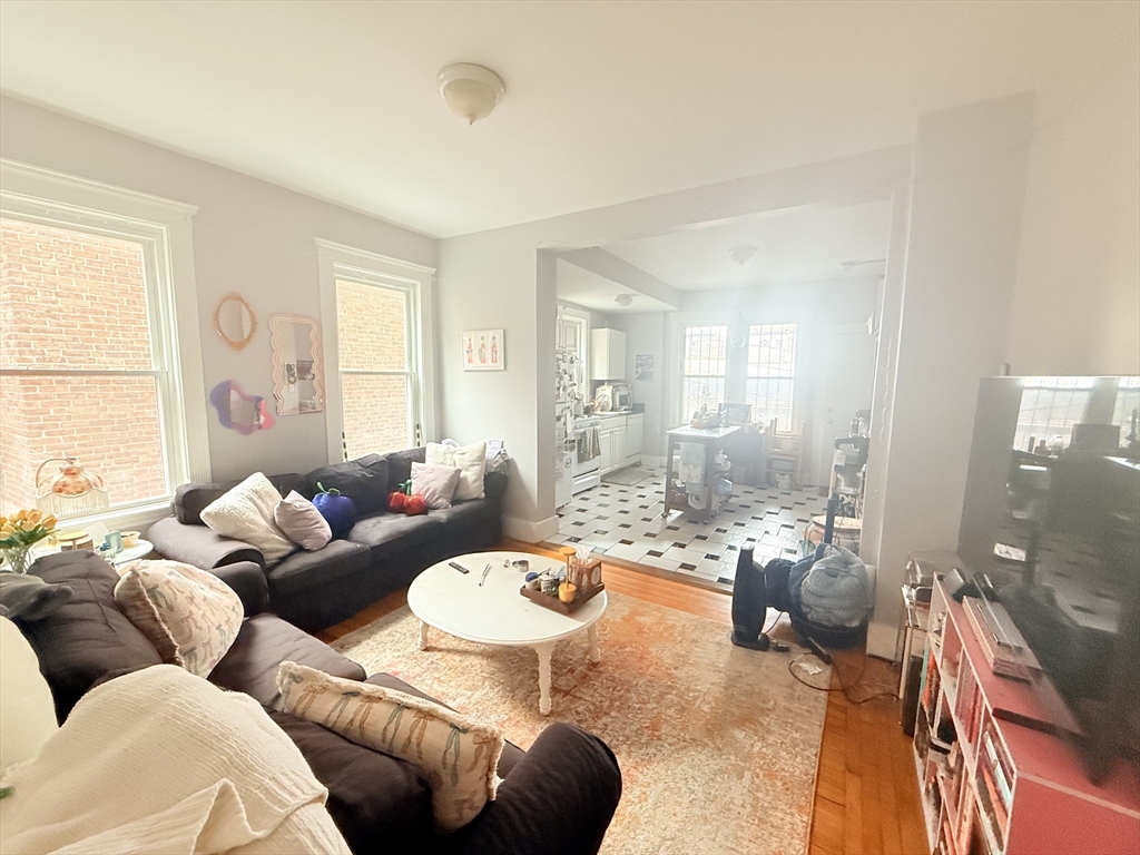 15 Chester Street, Unit 4 Boston, MA 02134 - Photo 7 of 20 a living room with furniture and a large window