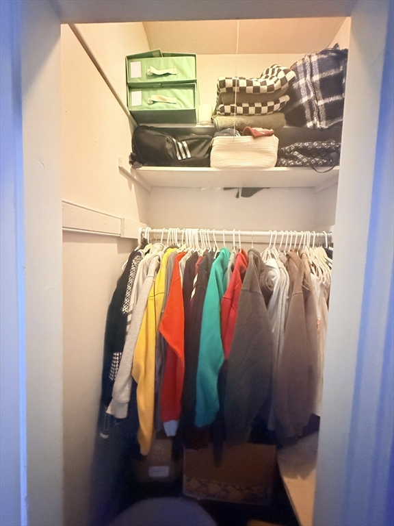 15 Chester Street, Unit 4 Boston, MA 02134 - Photo 8 of 20 a view of walk in closet with clothes and shoes