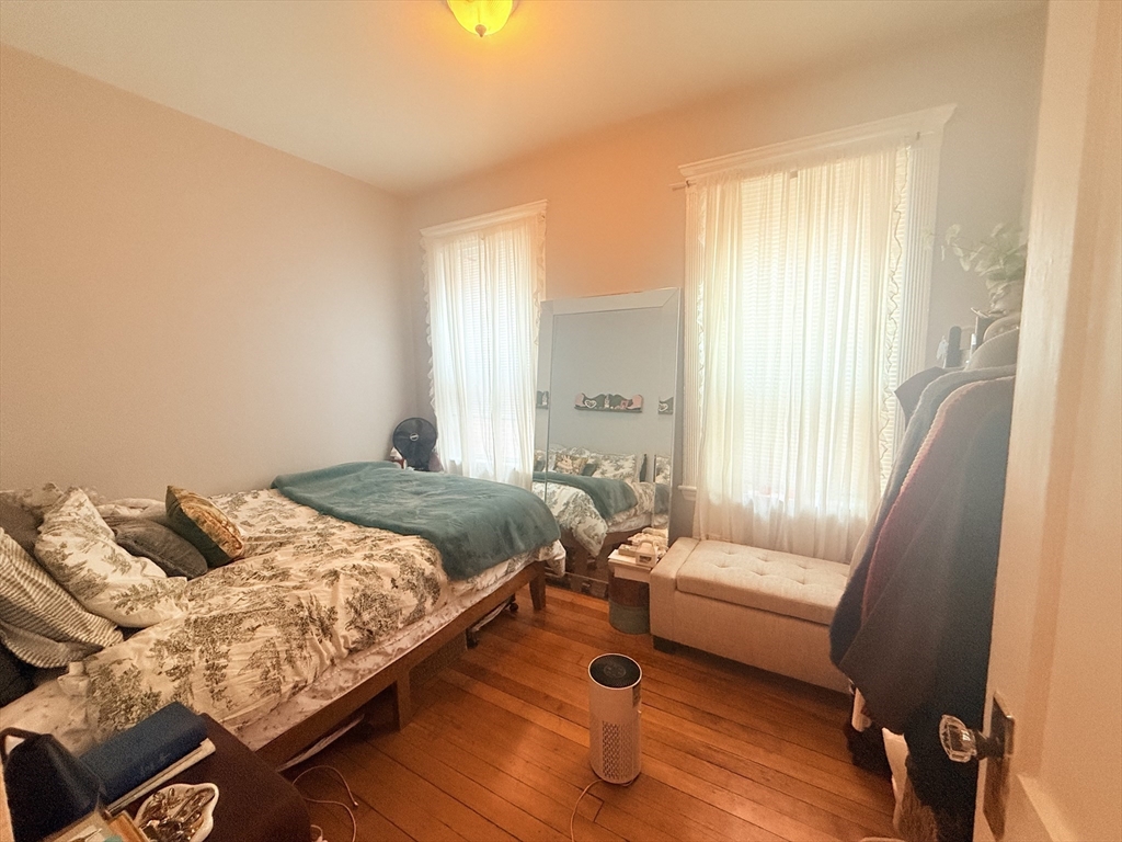 15 Chester Street, Unit 4 Boston, MA 02134 - Photo 9 of 20 a bedroom with furniture and a large window