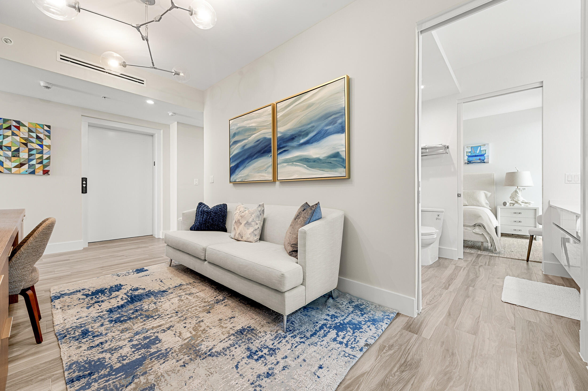 106 Inlet Way, Unit 103 Singer Island, FL 33404 - Photo 16 of 29 a living room with furniture and a rug