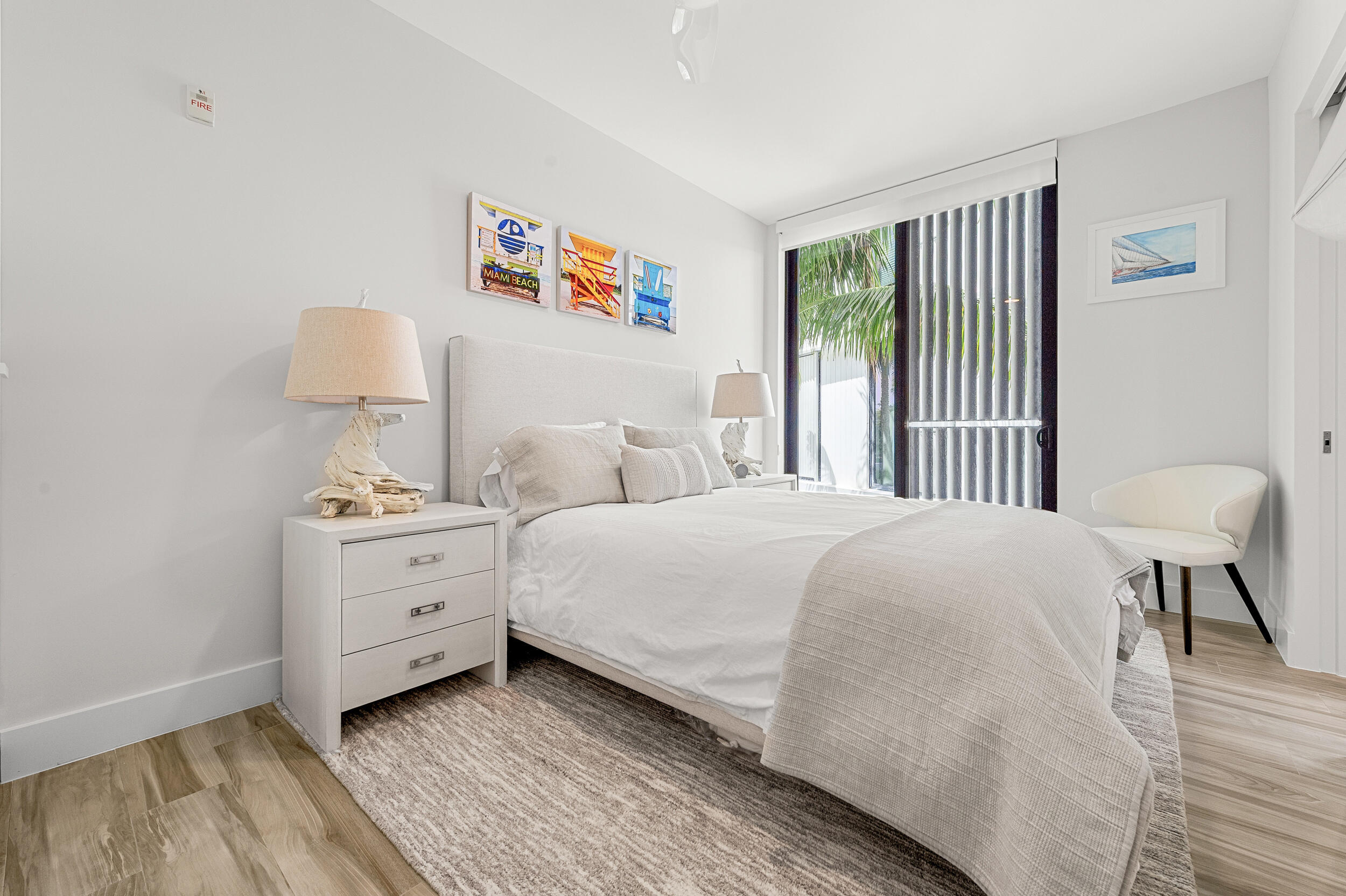 106 Inlet Way, Unit 103 Singer Island, FL 33404 - Photo 19 of 29 a bedroom with a bed and a window