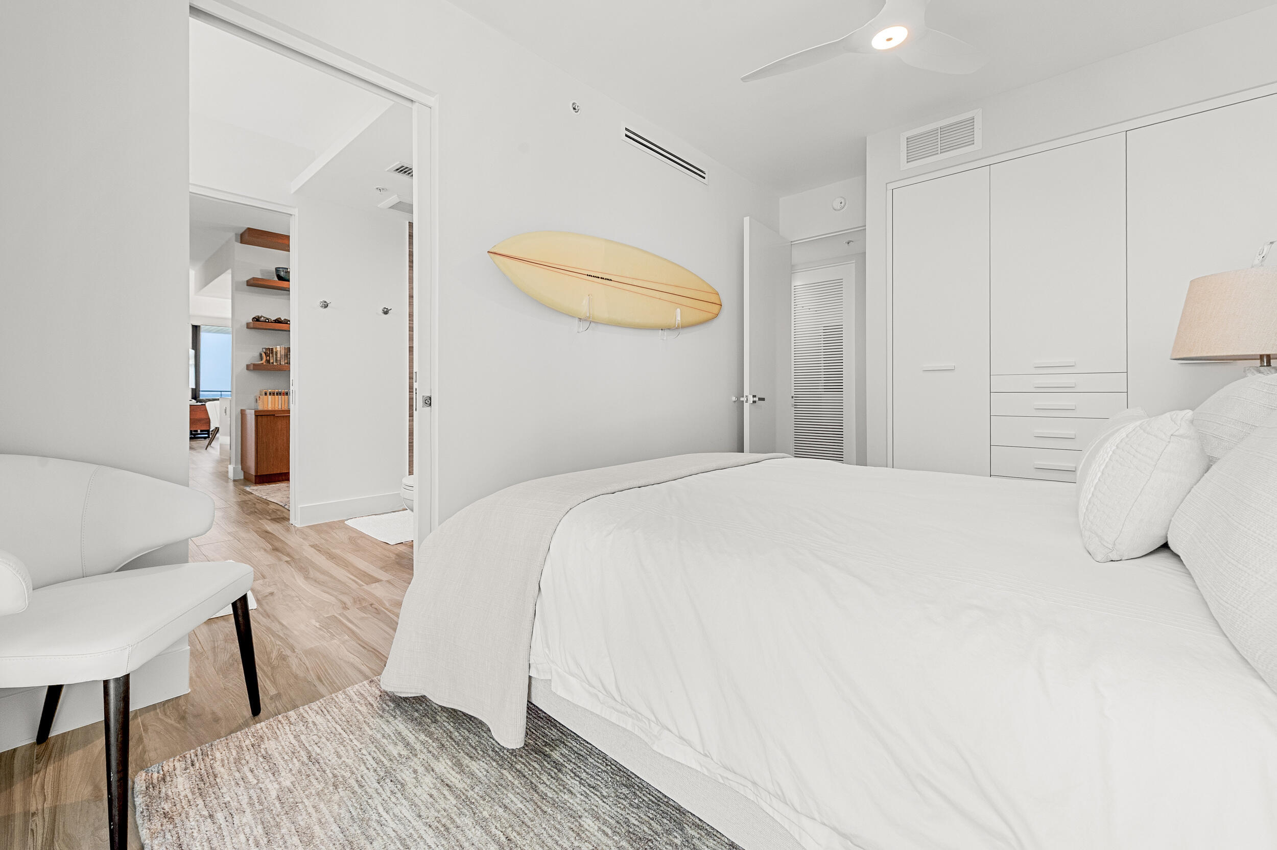 106 Inlet Way, Unit 103 Singer Island, FL 33404 - Photo 20 of 29 a bedroom with a bed and a chair in it