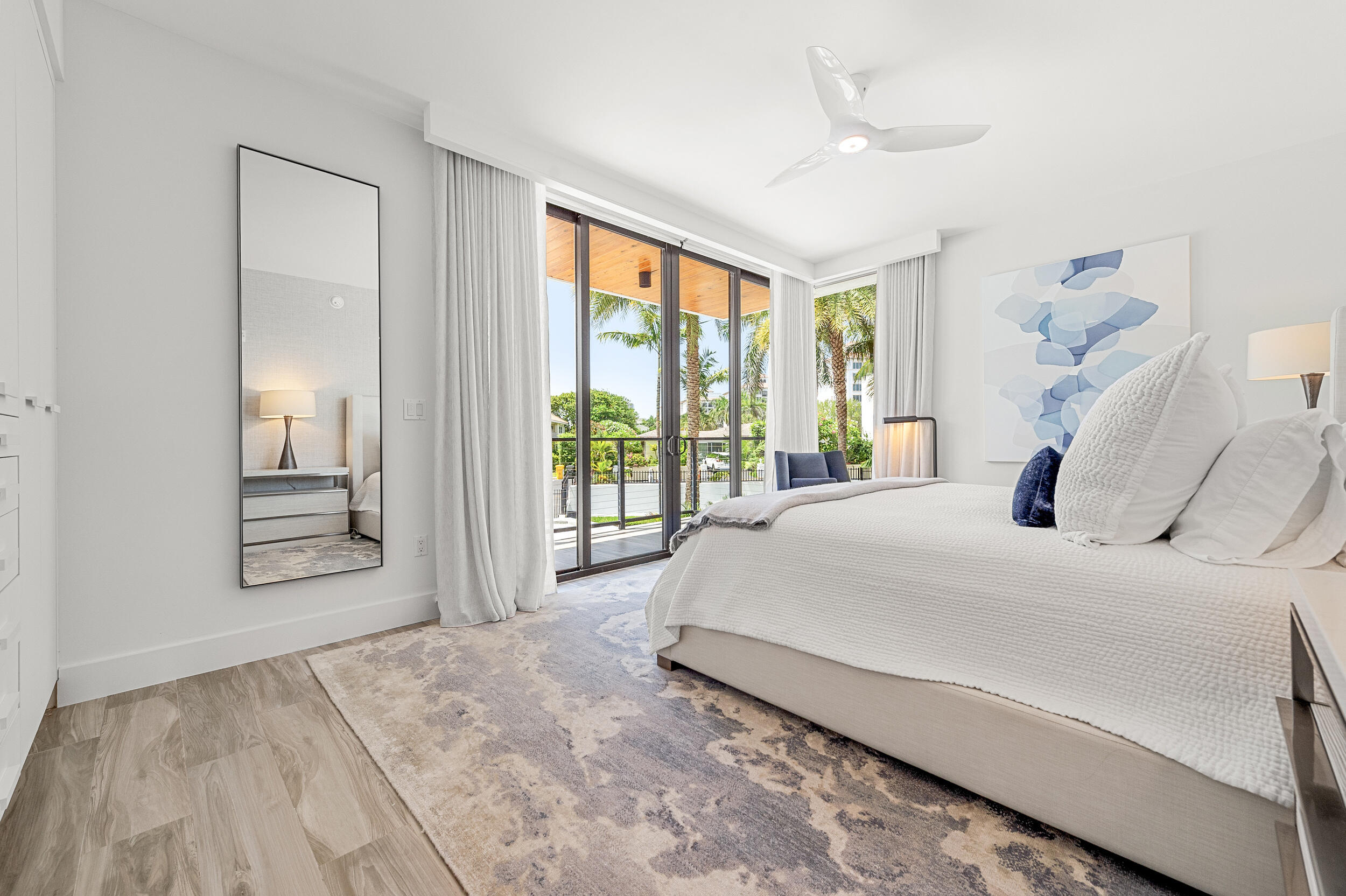 106 Inlet Way, Unit 103 Singer Island, FL 33404 - Photo 23 of 29 a bed sitting in a spacious bedroom next to a window