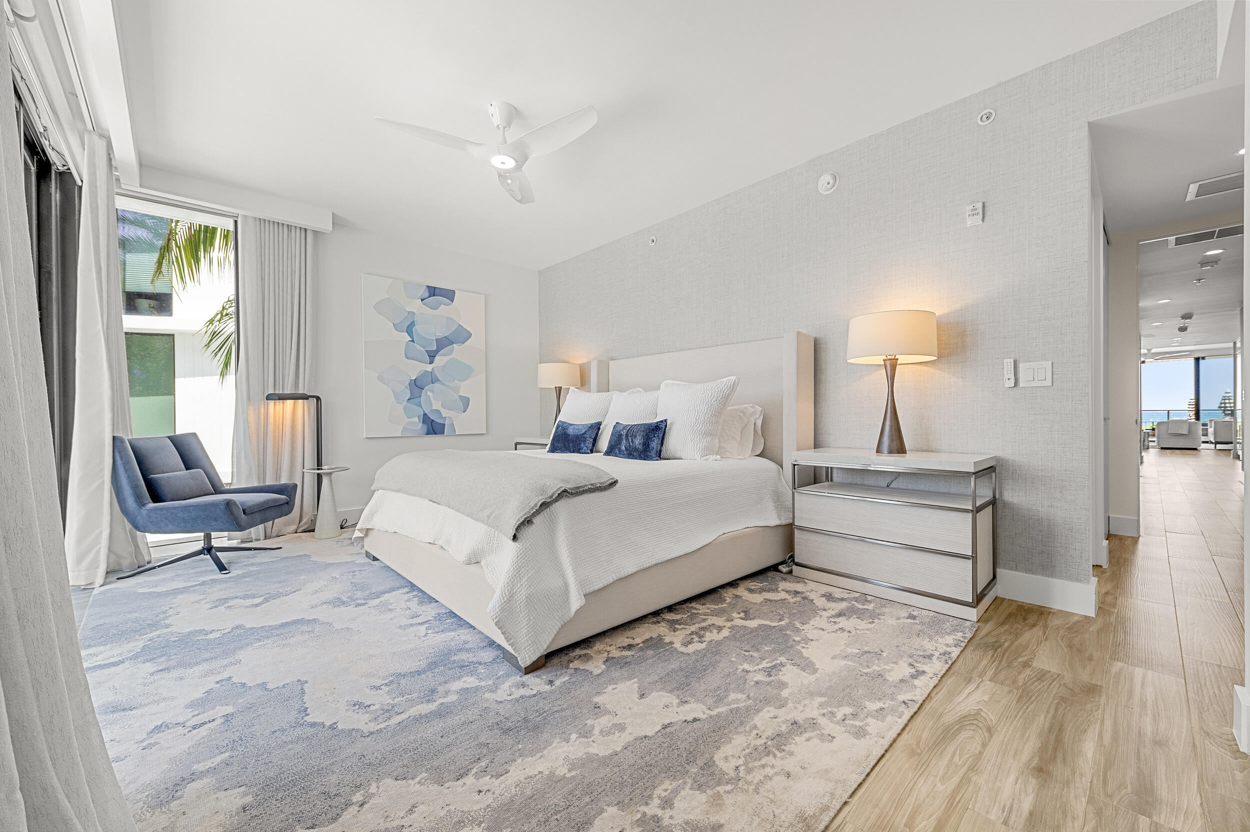 106 Inlet Way, Unit 103 Singer Island, FL 33404 - Photo 24 of 29 a bed room with a bed and a chair