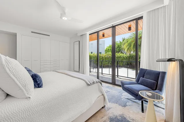 a bedroom with a bed and a couch