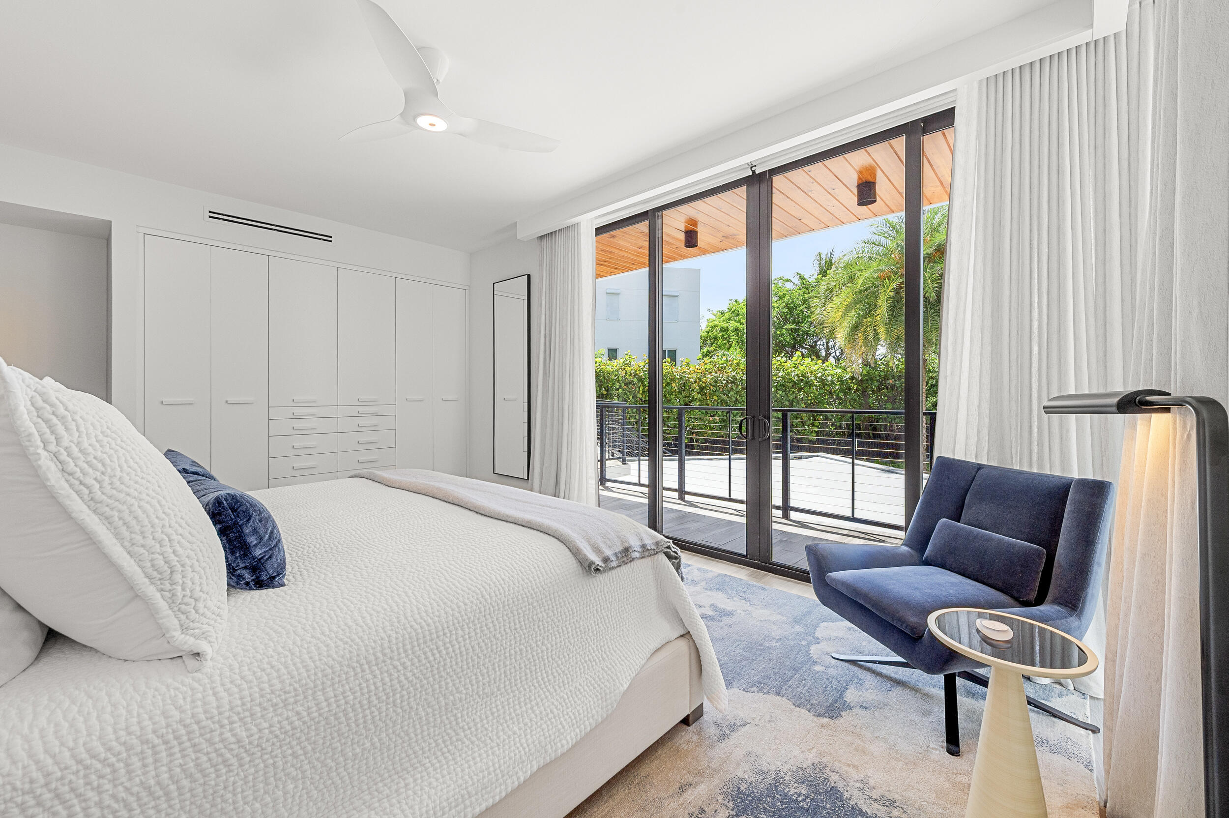 106 Inlet Way, Unit 103 Singer Island, FL 33404 - Photo 25 of 29 a bedroom with a bed and a couch