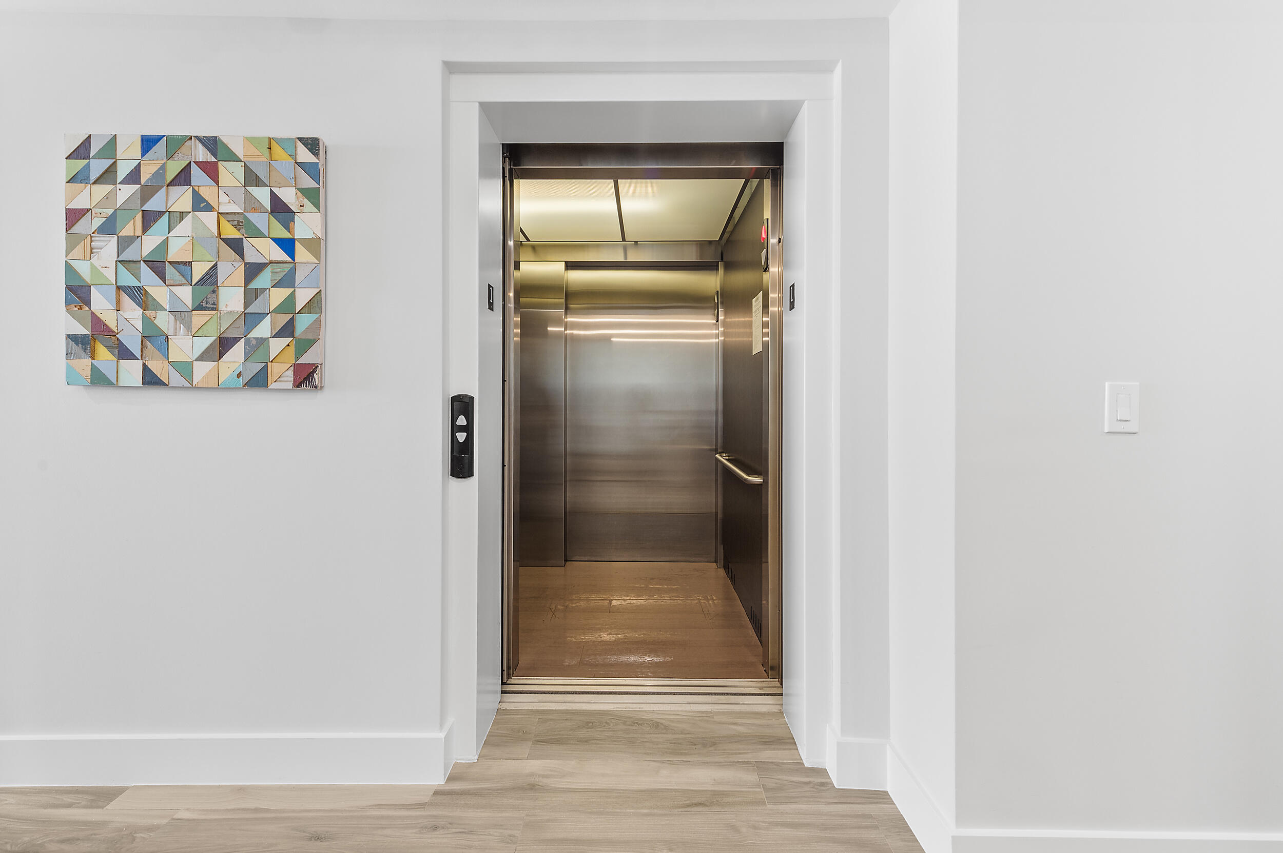106 Inlet Way, Unit 103 Singer Island, FL 33404 - Photo 28 of 29 a view of entryway with wooden floor