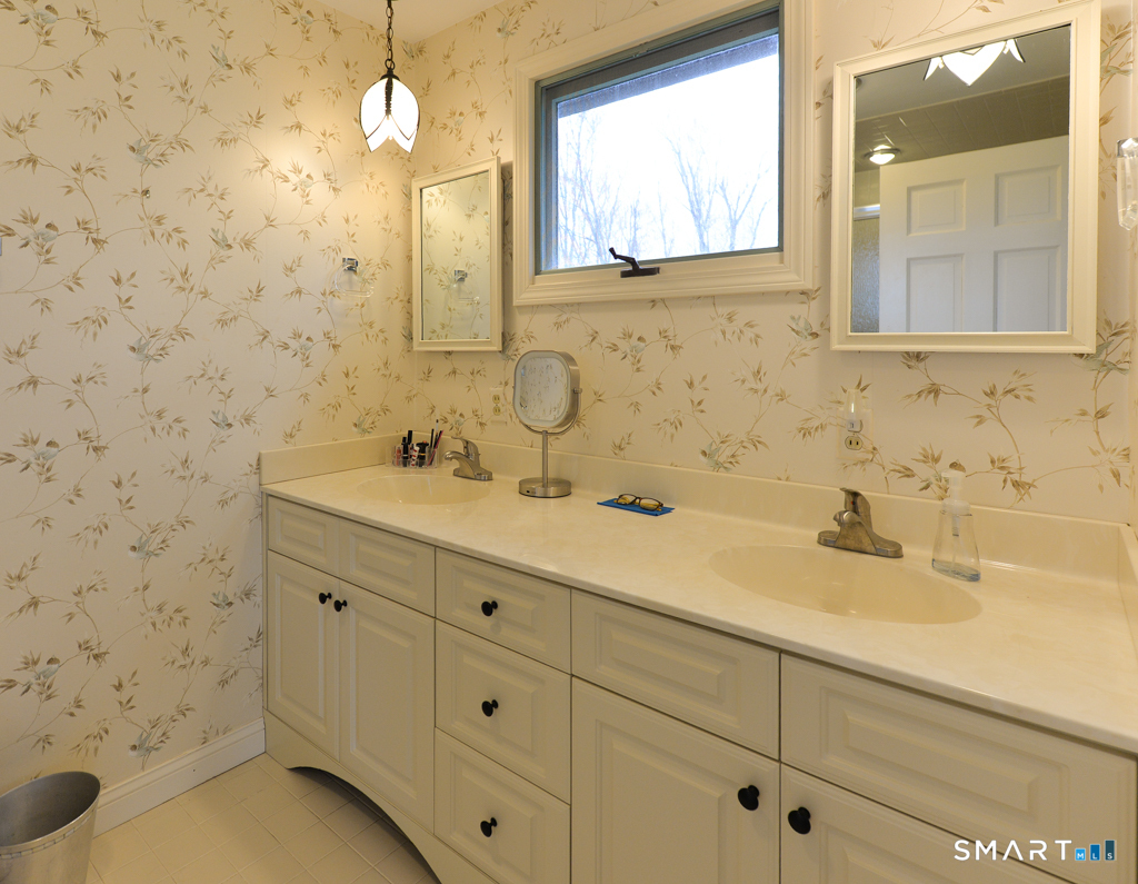 174 SW Road Waterbury, CT 06708 - Photo 11 of 17 a bathroom with a sink and a mirror