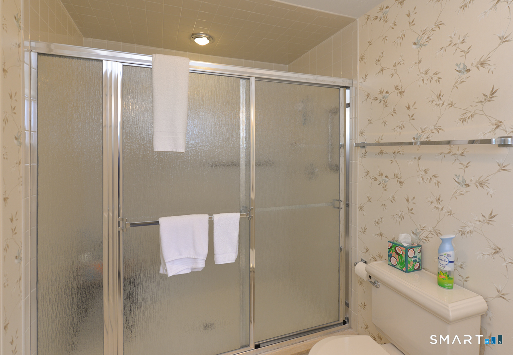 174 SW Road Waterbury, CT 06708 - Photo 12 of 17 a bathroom with a shower and a toilet