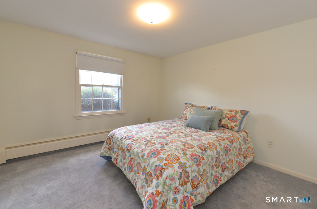 174 SW Road Waterbury, CT 06708 - Photo 13 of 17 a bedroom with a bed and window