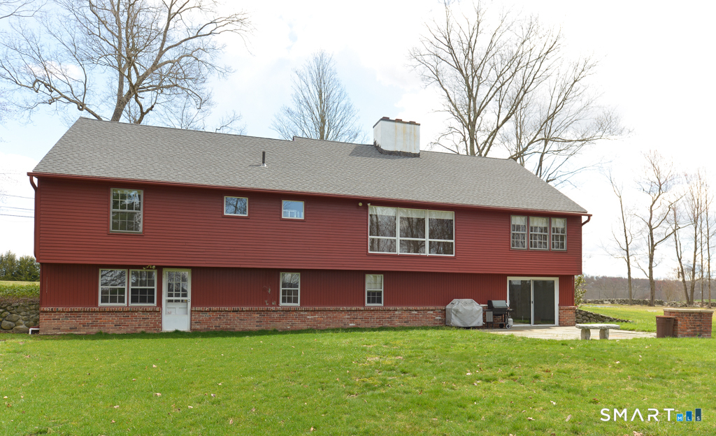 174 SW Road Waterbury, CT 06708 - Photo 2 of 17 a view of a house with a yard