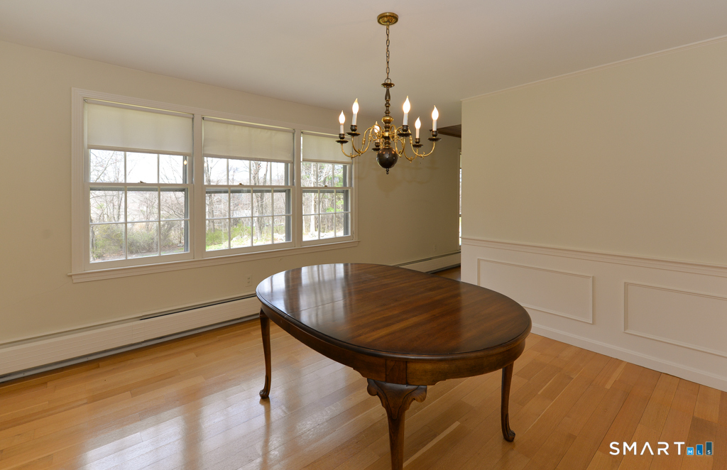 174 SW Road Waterbury, CT 06708 - Photo 5 of 17 a view of a dining room with furniture and window