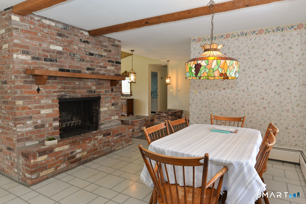 174 SW Road Waterbury, CT 06708 - Photo 7 of 17 a outdoor space with a fireplace