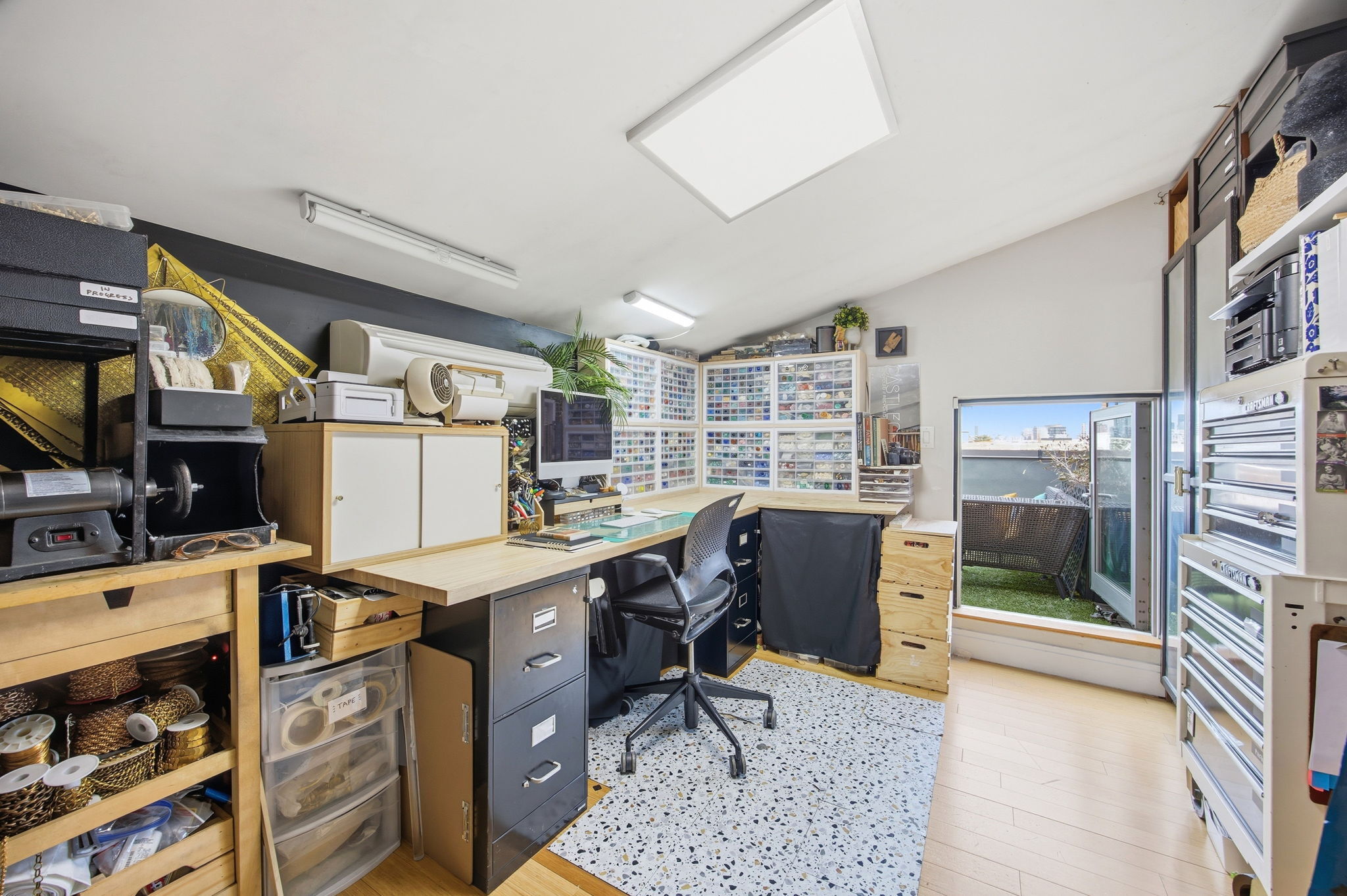 175 12th Street, Unit 4B Brooklyn, NY 11215 - Photo 18 of 27 a view of a workspace with furniture and a kitchen
