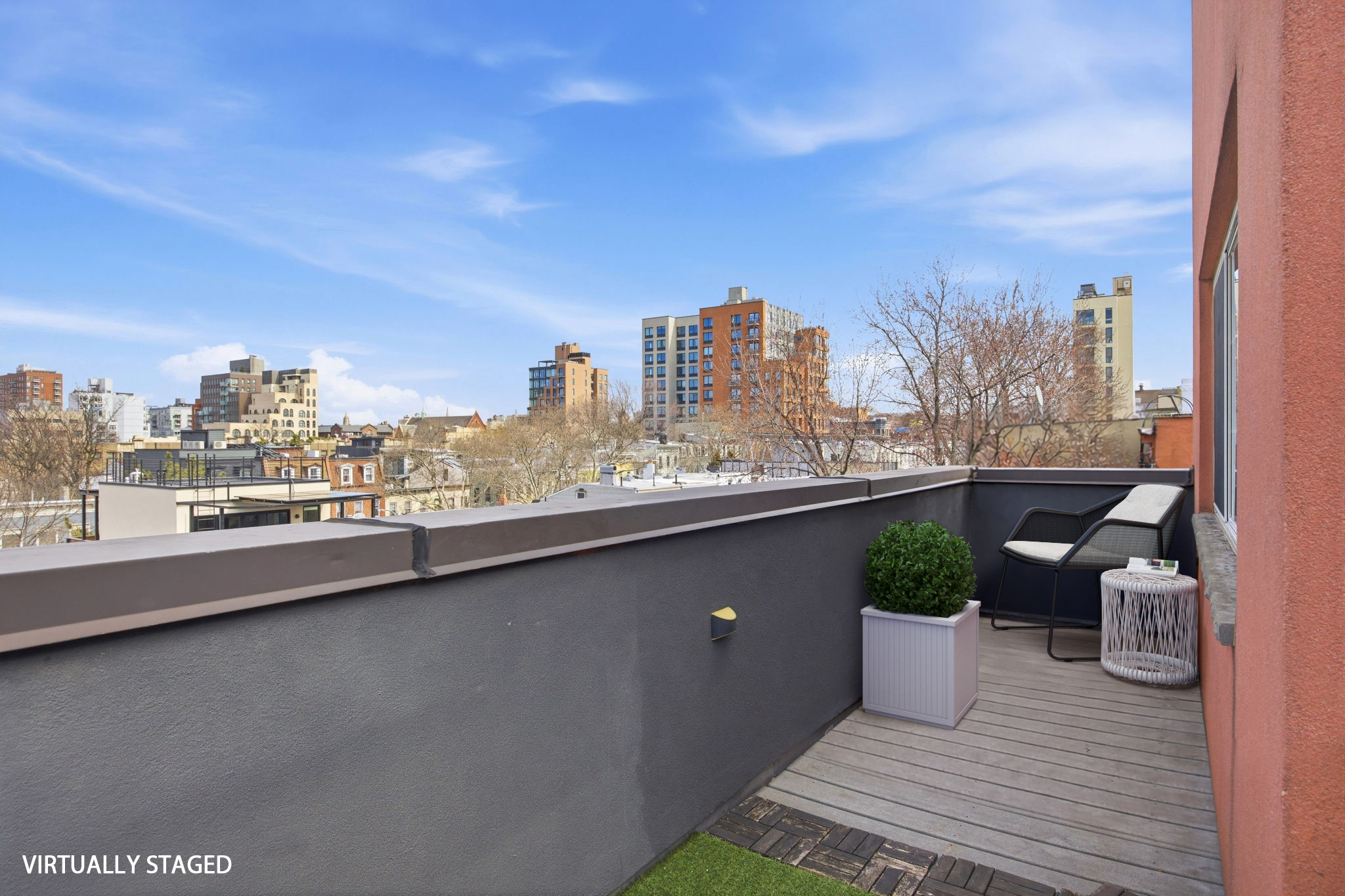 175 12th Street, Unit 4B Brooklyn, NY 11215 - Photo 24 of 27 a view of a balcony with furniture and wooden floor