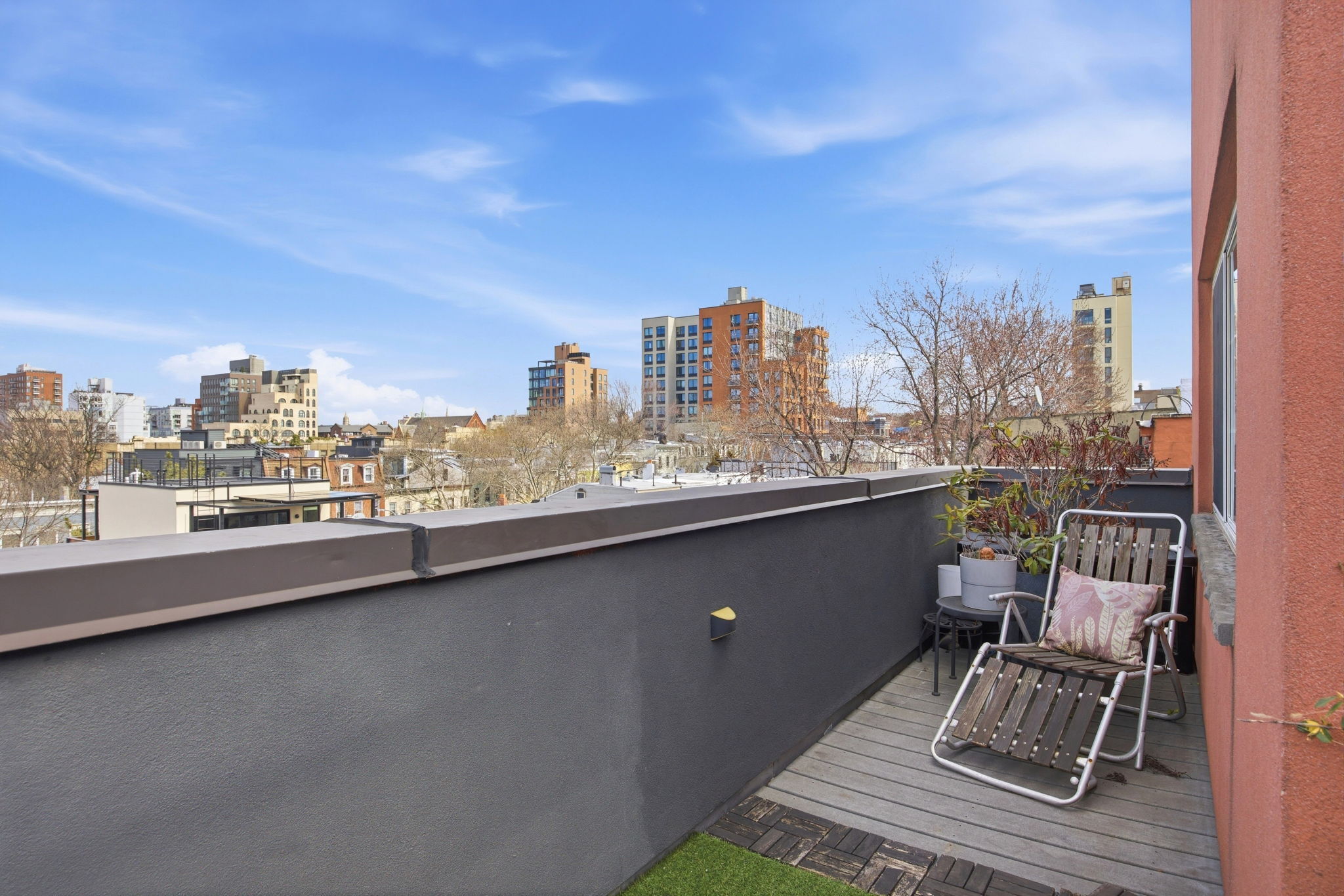 175 12th Street, Unit 4B Brooklyn, NY 11215 - Photo 25 of 27 a view of roof deck with chairs and wooden floor