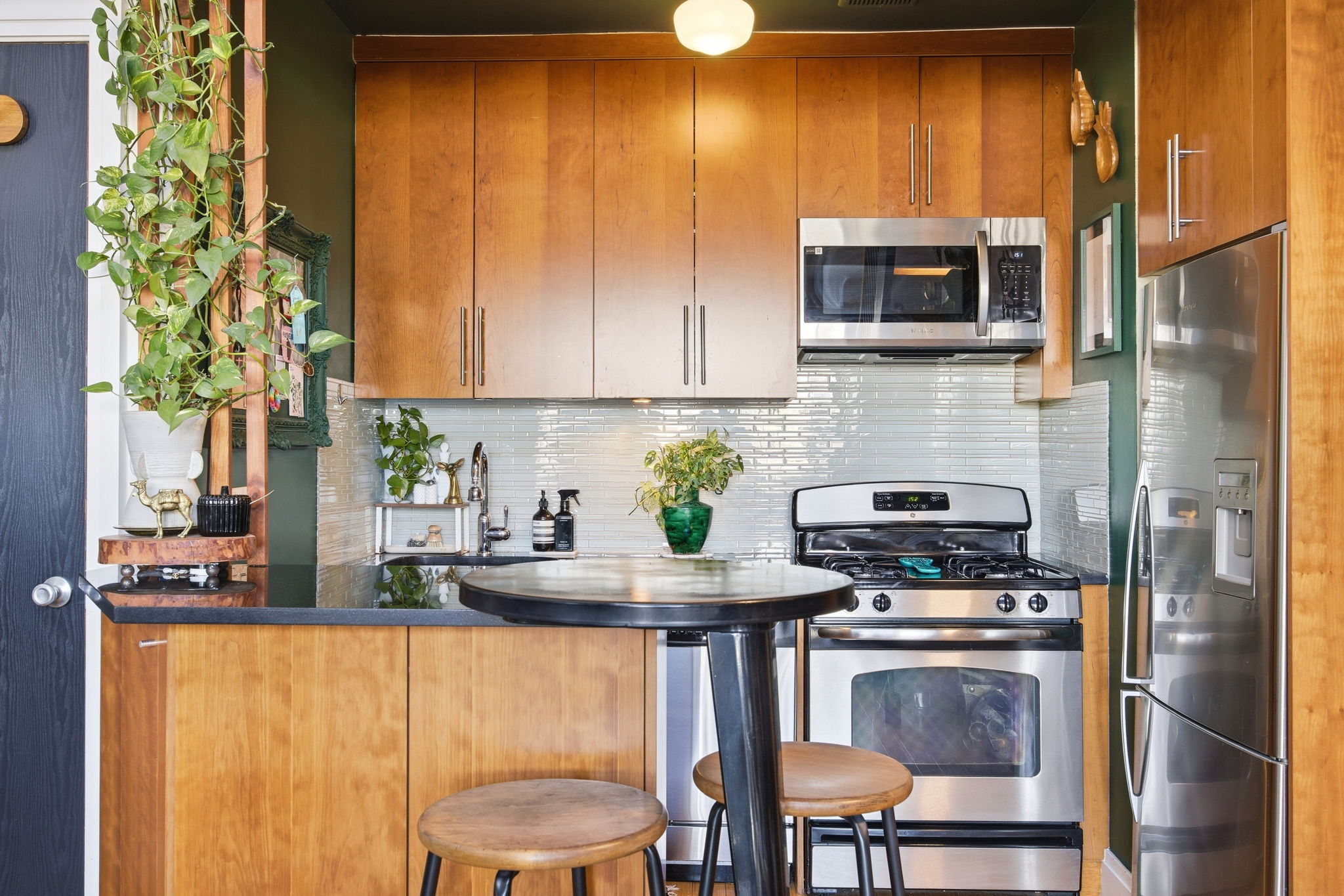 175 12th Street, Unit 4B Brooklyn, NY 11215 - Photo 8 of 27 a kitchen with stainless steel appliances a stove a refrigerator and a microwave