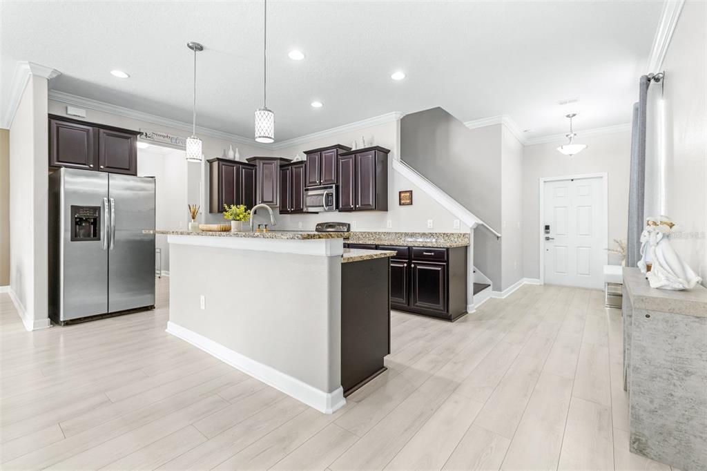 1762 Hadden Hall Place Trinity, FL 34655 - Photo 10 of 49 a kitchen with a sink stainless steel appliances and counter space