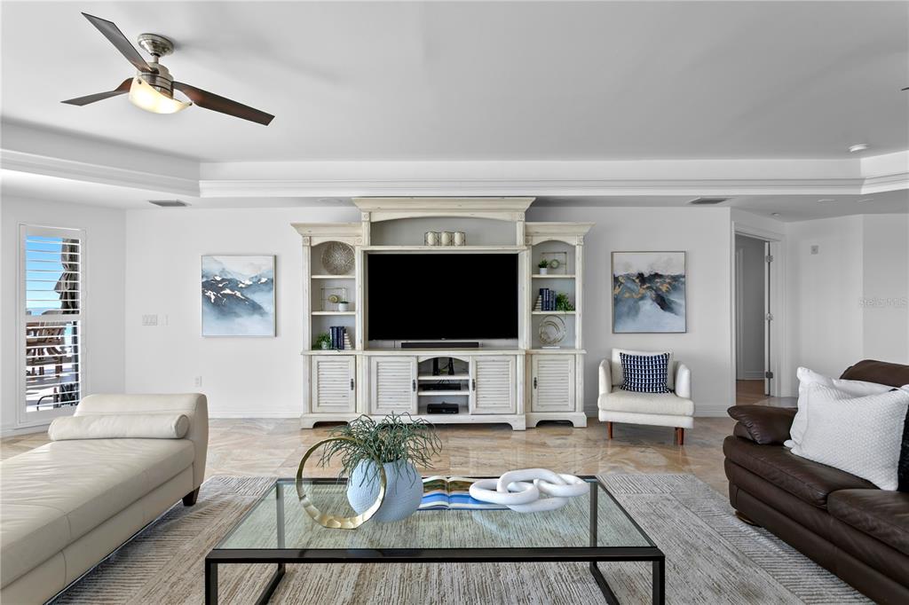 19730 Gulf Boulevard, Unit 400 Indian Rocks Beach, FL 33785 - Photo 22 of 90 a living room with furniture and a flat screen tv
